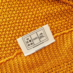 Karaca Home ocker Strickdecke Öko-Tex zertifiziert